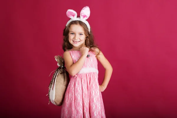 Child girl with pink is wearing bunny ears — Stock Photo, Image