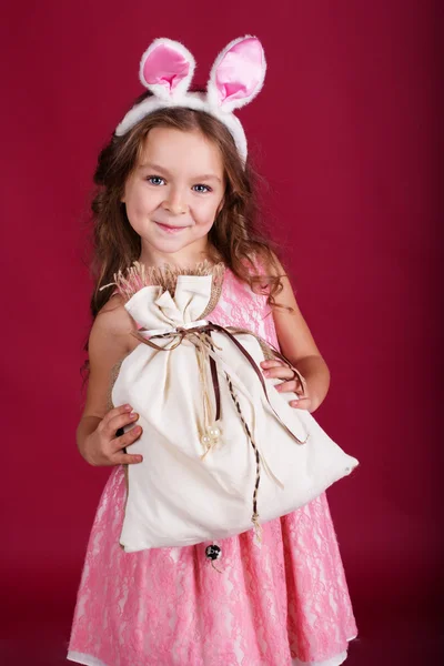 Child girl is wearing pink ears, christmas time — Stock Photo, Image