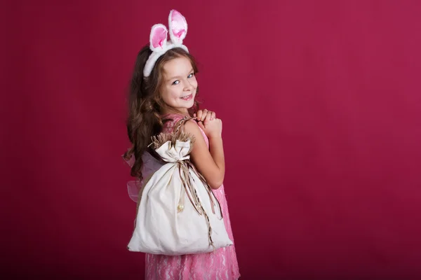 Child girl is wearing rabbit ears, christmas time — Stock Photo, Image