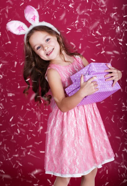 Happy bunny girl with gift boxes — Stock Photo, Image