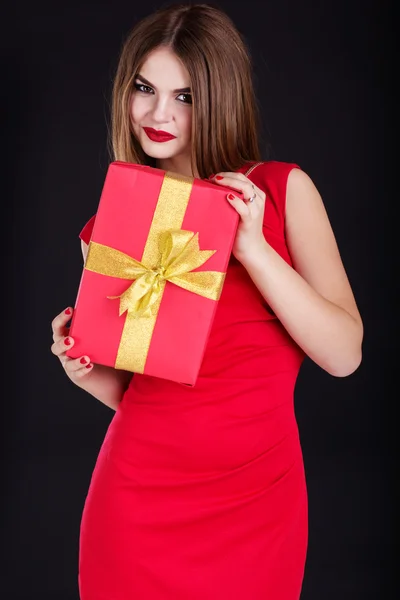 Pretty girl is wearing fashion dress with gift box — Stock Photo, Image