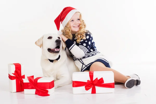 Child girl with dog are sitting in studio — Stock Photo, Image