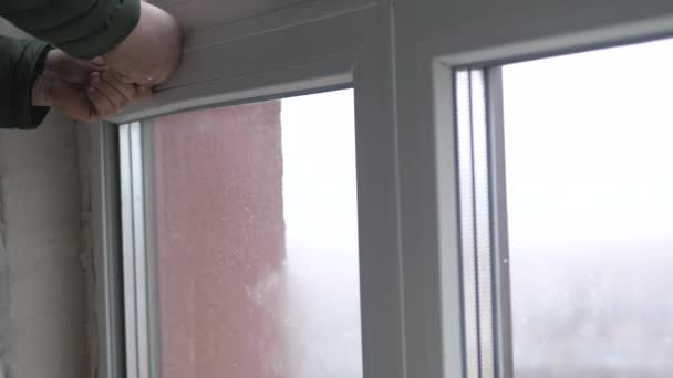 Windows installation worker, construction worker sets of plastic window. Close up of hand — Stock Footage Windows installation worker, construction worker sets of plastic window. Close up of hand Stock Video