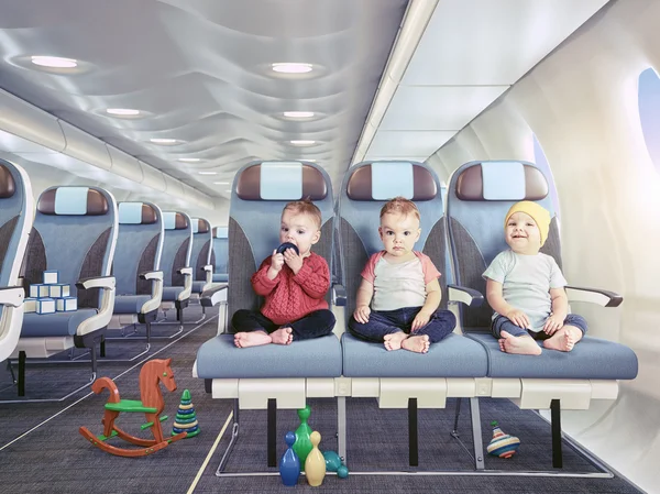 Triplets in the airplane — Stock Photo, Image