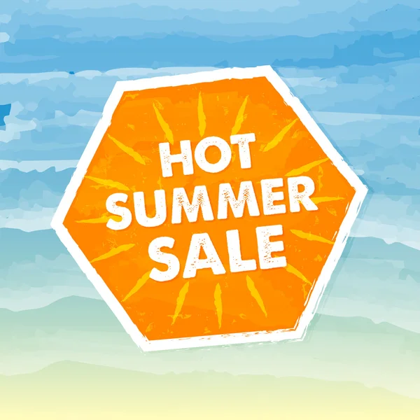 Hot summer sale in orange label over sea background — Stock Photo, Image