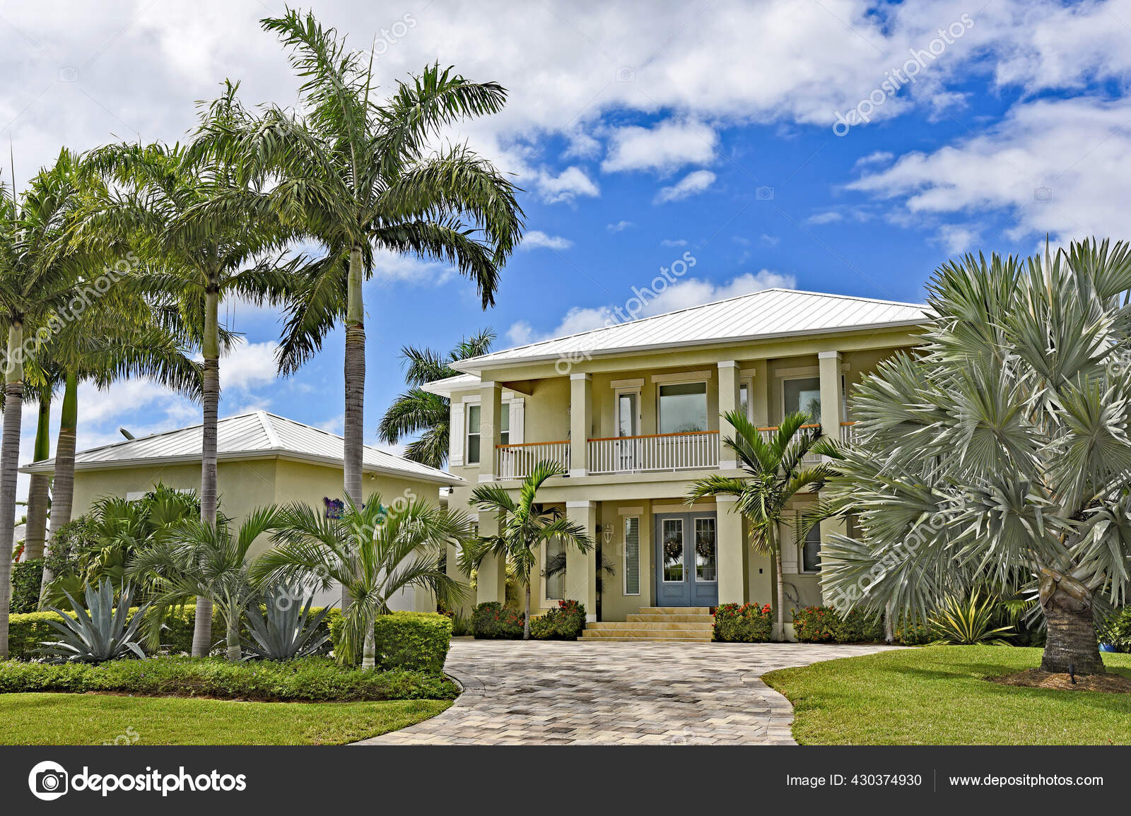 Large New Beach House Florida Palm Trees Landscaping Stock Photo by ©EyeMark 430374930