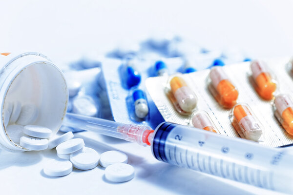 Syringe with medications pills drug
