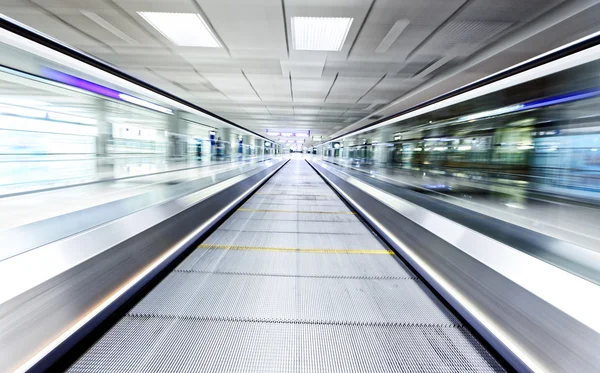 Symmetric moving blue escalator — Stock Photo, Image