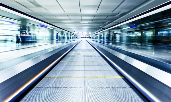 Symmetric moving blue escalator — Stock Photo, Image