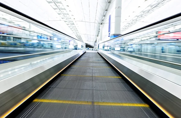 Symmetric moving blue escalator — Stock Photo, Image