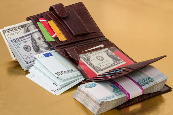 Wallet filled with money and credit cards — Stock Photo, Image