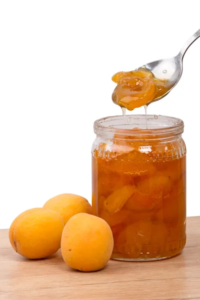 Fresh apricots and jam in a jar — Stock Photo, Image