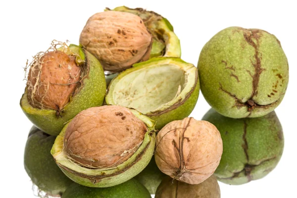 Walnuts and green shell — Stock Photo, Image