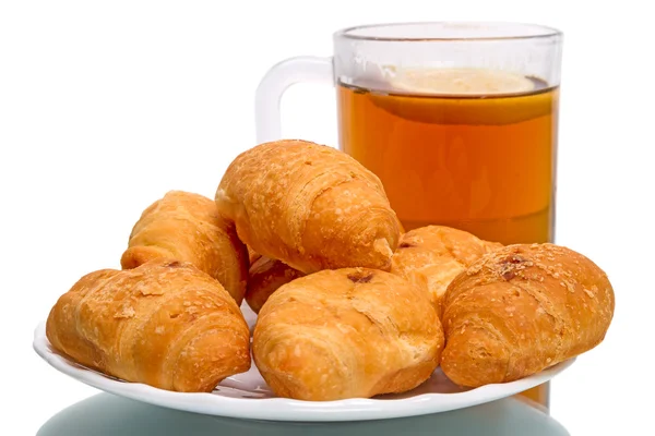 Tea with lemon and croissants — Stock Photo, Image