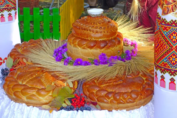 Large loaf of bread with salt shaker — Stock Photo, Image