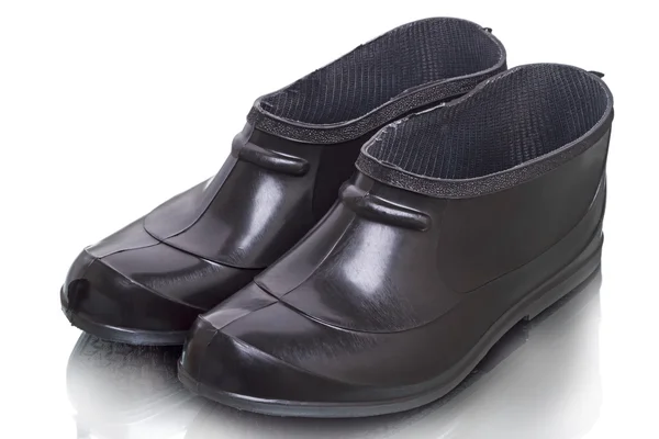 Korte zwarte rubberen laarzen — Stockfoto