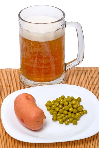 Beer with sausage and green peas — Stock Photo, Image