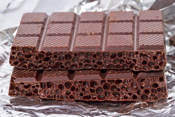 Aerated chocolate on foil — Stock Photo, Image