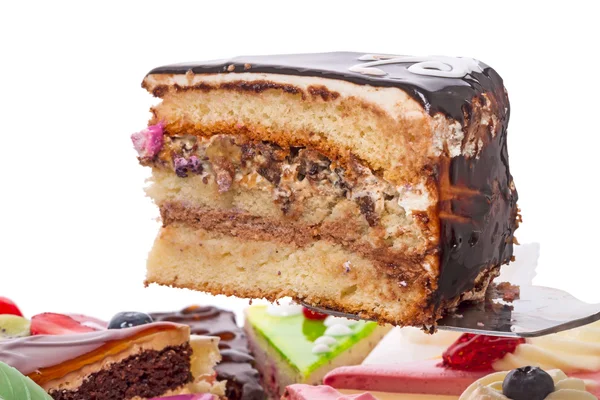 Piece of cake covered with chocolate — Stock Photo, Image