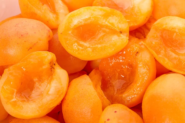 Background of ripe apricot halves — Stock Photo, Image