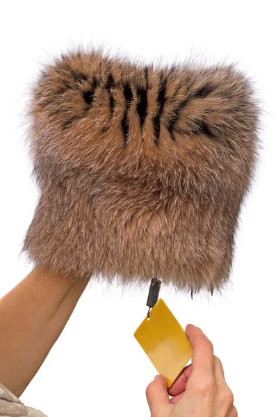 Hands with a new fur cap — Stock Photo, Image