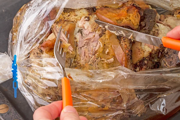 Baked meat with apples in the package for baking — Stock Photo, Image