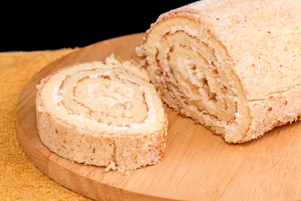 Cake roll on kitchen board — Stock Photo, Image