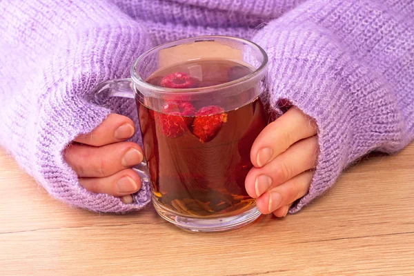 Woman warmed by hot tea — Stock Photo, Image