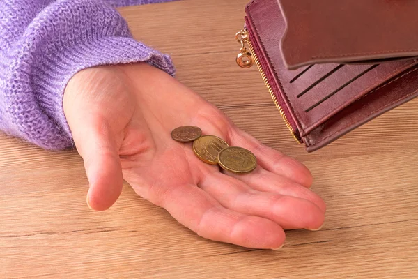 Woman with three coins — Stock Photo, Image