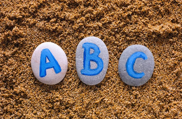 ABC letras sobre piedras —  Fotos de Stock