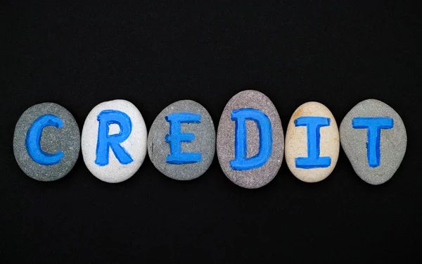 Word Credit spell out from stones with letters — Stock Photo, Image