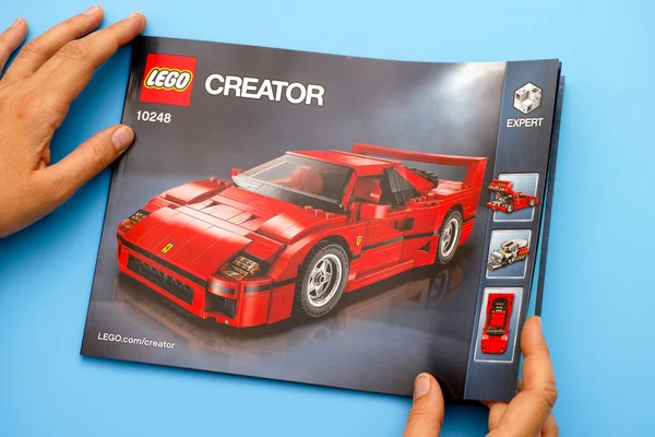 Lego instruction of set 10248 Ferrari F40 in hands — Stock Photo, Image