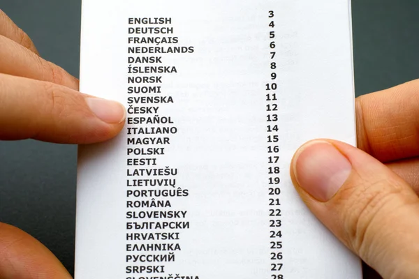 Reading booklet with list of languages — Stock Photo, Image