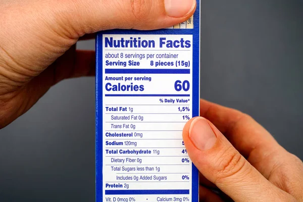 Nutrition Facts Food Box Woman Hands Gray Background — Stock Photo, Image
