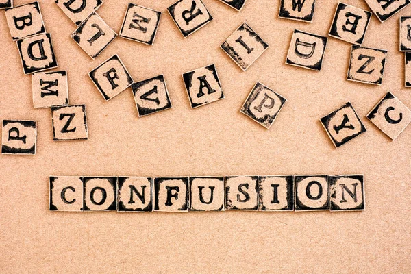 Word Confusion Spelled Out Cardboard Letters Made Black Alphabet Stamps — Stock Photo, Image