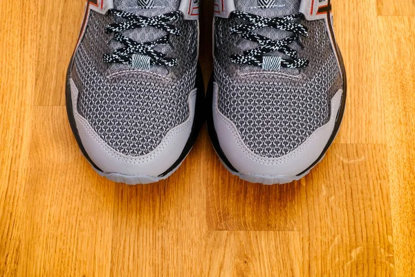 New Gray Running Shoes Parquet Floor Background — Stock Photo, Image