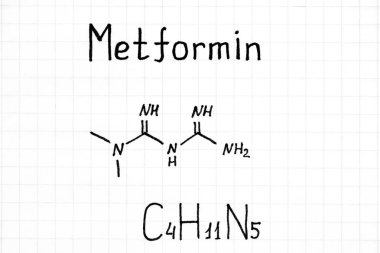 Metformin 'in el yazısı kimyasal formülü. Yakın plan..
