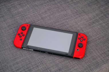 Tambov, Rusya Federasyonu - 22 Haziran 2019 Nintendo Gri tekstil arka planı video oyun konsolu.