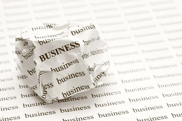 Crumpled paper ball with words business — Stock Photo, Image