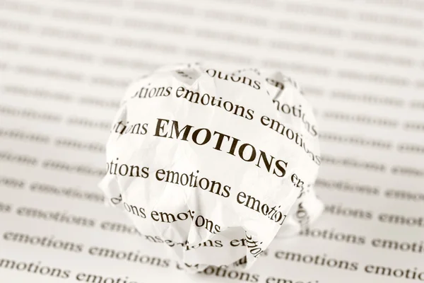 Crumpled paper ball with words emotions — Stock Photo, Image