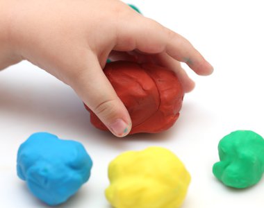 Child's hand with playdough clipart
