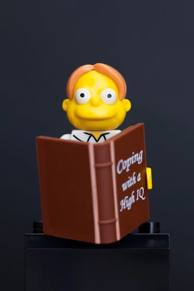 Lego Martin Prince minifigure with book — Stock Photo, Image