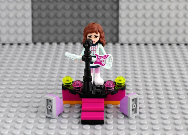 Lego friends girl with electric guitar on the stage — Stock Photo, Image