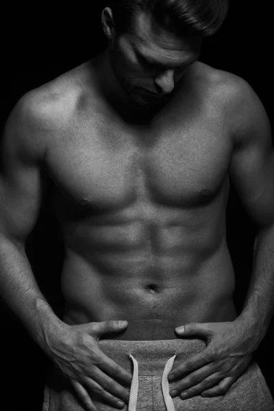 Fuerte ajuste muscular hombre blanco y negro — Foto de Stock