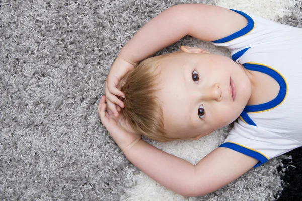 Cute baby lying on back Royalty Free Stock Photos