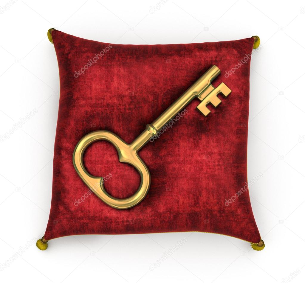 Golden key on royal red velvet pillow isolated on white backgrou