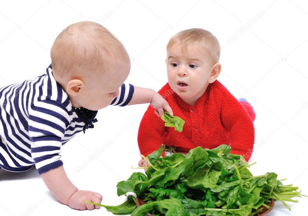 two baby and spinach