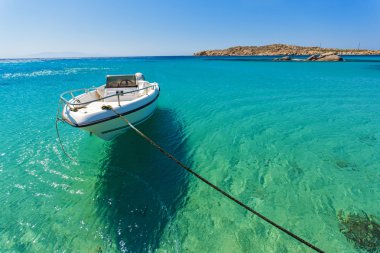 Clear waters of Paranga Beach on the island of Mykonos,  Greece clipart