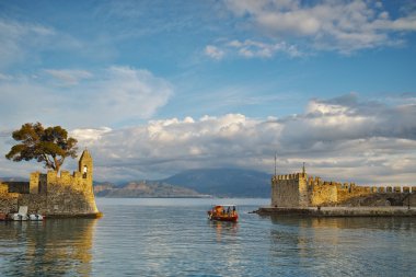Sunset Panorama of the port of Nafpaktos town clipart