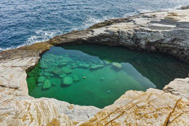 Clean waters of Giola Natural Pool in Thassos island, East Macedonia and Thrace, clipart